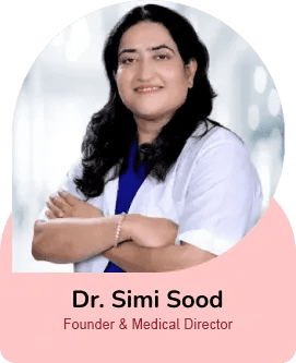 Portrait of Dr. Simi Sood, Founder and Medical Director, smiling with arms crossed in a pink rounded badge.
